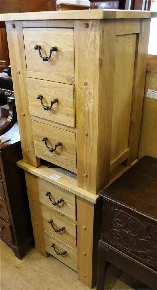 A pair of light oak bedside chests